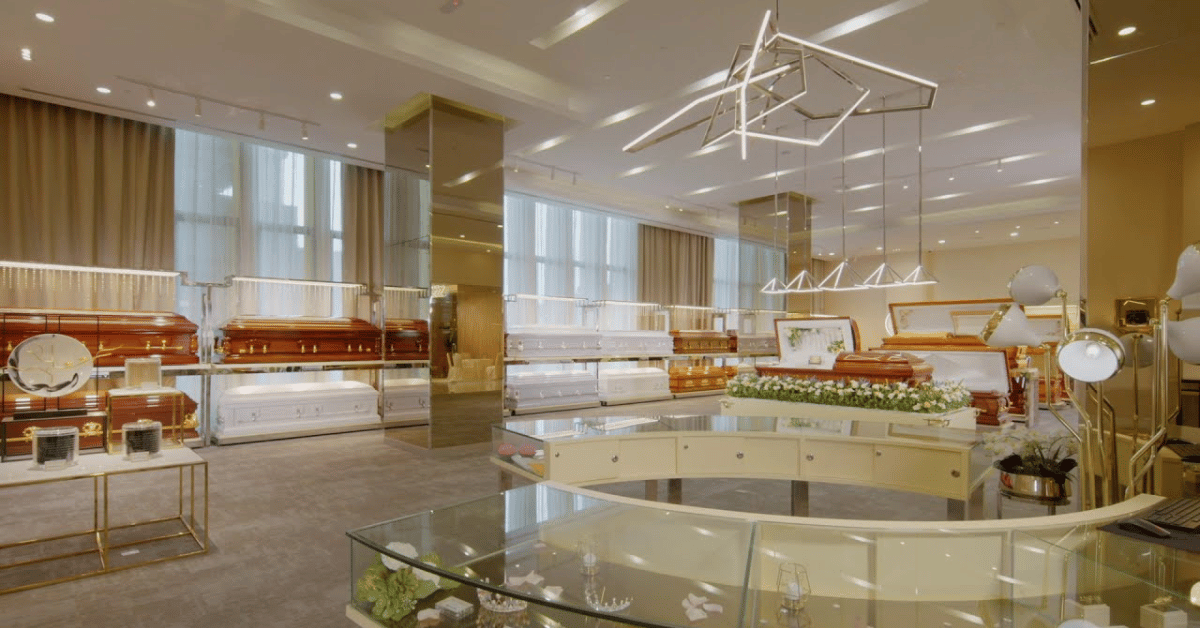 Funeral parlour showroom with caskets and memorial displays